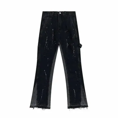 Black distressed flared jeans with mesh side panels, photographed flat on white
