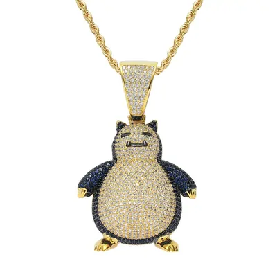 A pendant shaped like a sleeping cartoon character, set with clear and blue stones, hanging from a gold rope chain